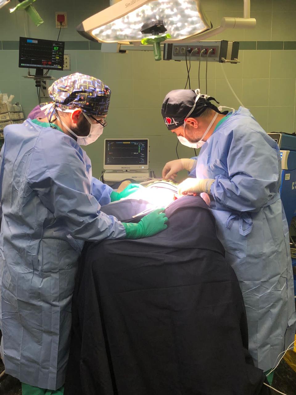 Dr. Joseph Gharios performing surgery with a medical team